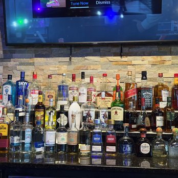 Juicy Seafood Flint - bottles of liquor on a bar counter - Seafood Near Me - Flint, Michigan Juicy Seafood Flint - bottles of liquor on a bar counter - Seafood Near Me - Flint, Michigan