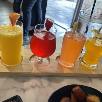Rosalia's Kitchen - Mimosa flight: orange, strawberry, peach, and mango flavors - Italian Near Me - Miramar, Florida Rosalia's Kitchen - Mimosa flight: orange, strawberry, peach, and mango flavors - Italian Near Me - Miramar, Florida