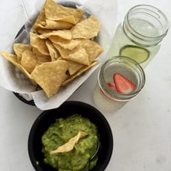 A Table At Greenane Farm - Mexican lemonade, table water (they put strawberry slices in) and delicious chips and guacamole.