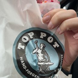 a person holding a donut