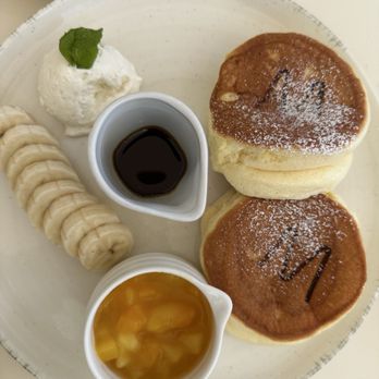 Westman Cafe - Soufflé pancakes with tropical sauce (mango pineapple) - Cafes Near Me - Urban Honolulu, Hawaii