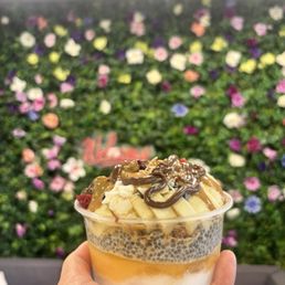 Coconut & Passion fruit base, vanilla chia seed, honey almond granola, banana, strawberry and Nutella and peanut butter drizzle Coconut & Passion fruit base, vanilla chia seed, honey almond granola, banana, strawberry and Nutella and peanut butter drizzle