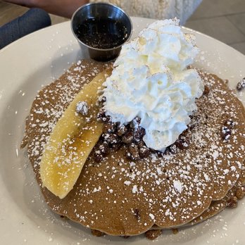 Hash Kitchen - Bananas Foster Pancakes with half of a banana - Breakfast & Brunch Near Me - Scottsdale, Arizona Hash Kitchen - Bananas Foster Pancakes with half of a banana - Breakfast & Brunch Near Me - Scottsdale, Arizona