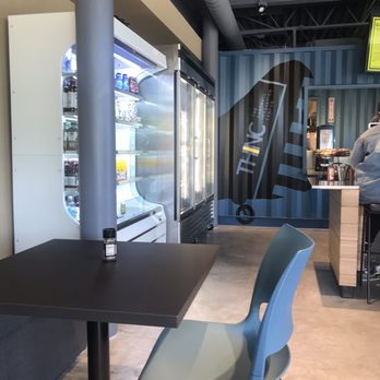 The Hangar Cafe - a table with a blue chair - Cafes Near Me - Lexington, Massachusetts The Hangar Cafe - a table with a blue chair - Cafes Near Me - Lexington, Massachusetts