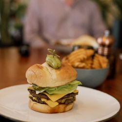 Station 36 in The LaSalle Hotel - Pullman burger two 4oz smash patties, bacon jam, american cheese, pickles, special sauce, lettuce, brioche