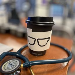 a coffee cup with a stethoscope attached to it a coffee cup with a stethoscope attached to it