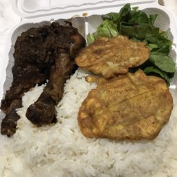 Spicy jerk chicken entree with delicious white rice and black beans sauce salad and two plaintains Spicy jerk chicken entree with delicious white rice and black beans sauce salad and two plaintains