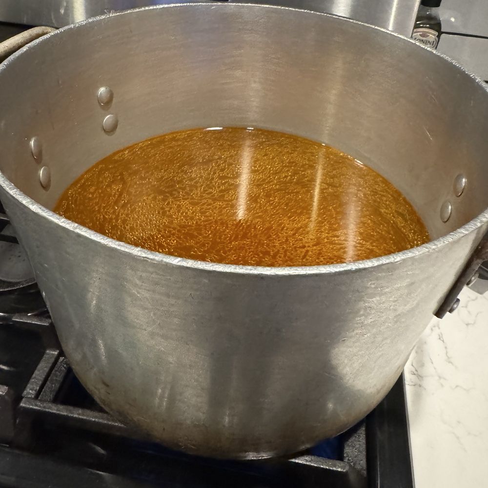 Pho Phi - The pot that was rented with 8 containers poured in warming on my stove - Vietnamese Near Me - Austin, Texas Pho Phi - The pot that was rented with 8 containers poured in warming on my stove - Vietnamese Near Me - Austin, Texas