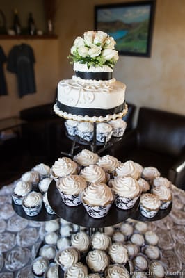 Photo of Deb's Delights - Chelan, WA, US. a tiered cake and cupcakes