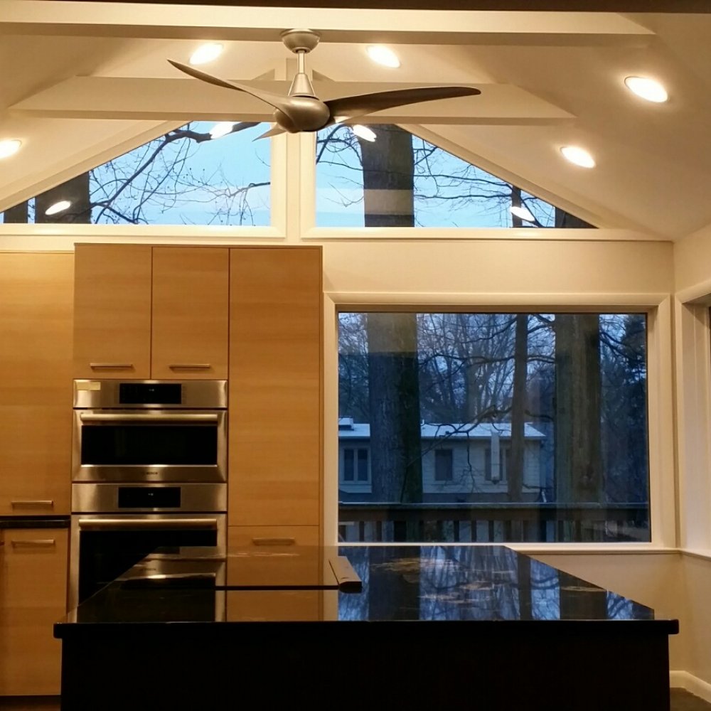 This kitchen, the centerpiece of the renovation, reflects a complete revamping of an existing porch.