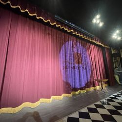 Smoke & Mirrors Magic Theater - Front row puts you close to the illusions and was only $10 more.