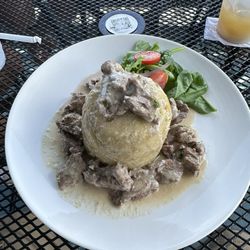 Marea Alta - Mofongo (mashed plantain) with churrasco (skirt steak) in a crema de ajo (garlic sauce).
