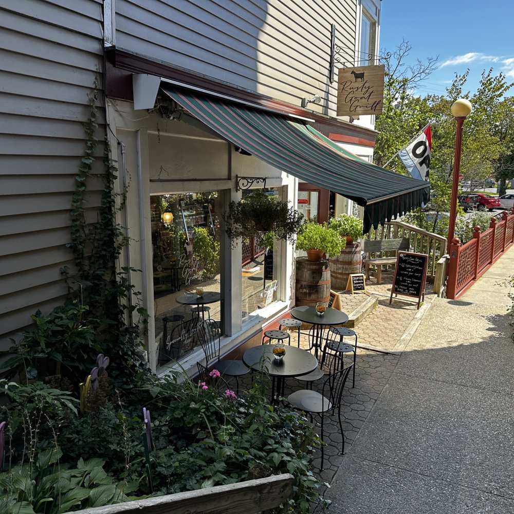 Rusty Goat Grill - a patio area with tables and chairs - Sandwiches Near Me - Warwick, New York