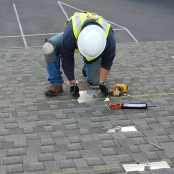 Solar Technologies - Installing the flashing mount over the caulking - Solar Installation Near Me - San Ramon, California Solar Technologies - Installing the flashing mount over the caulking - Solar Installation Near Me - San Ramon, California