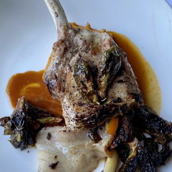 Canoe - Pork chop with fried Brussels and polenta waffle - New American Near Me - Atlanta, Georgia