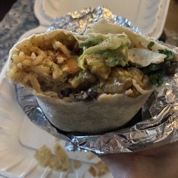 Moe's Southwest Grill - a hand holding a burrito - Mexican Near Me - Schofield Barracks, Hawaii Moe's Southwest Grill - a hand holding a burrito - Mexican Near Me - Schofield Barracks, Hawaii