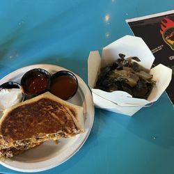 Brisket crunch wrap with side of collard greens