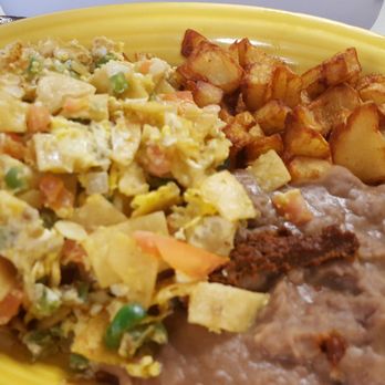 Tejas Taco House - Migas with refried beans and crispy potatoes. - Mexican Near Me - Houston, Texas