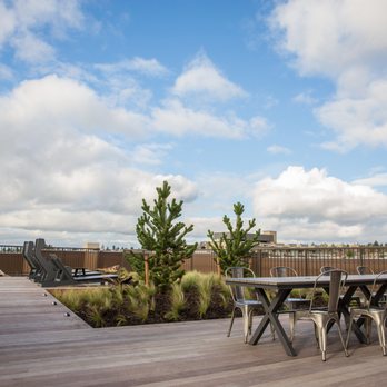 JH Landscaping and Irrigation - a patio with a table and chairs - Landscaping Near Me - Bothell, Washington JH Landscaping and Irrigation - a patio with a table and chairs - Landscaping Near Me - Bothell, Washington