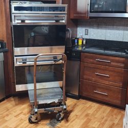 Brunswick Appliance Repair - Ovens left out of the wall. Cart blocking dishwasher and stove top.