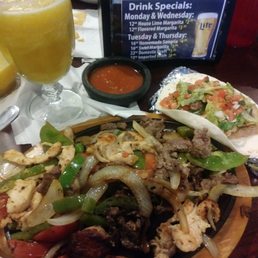 Steak/chicken fajitas for two. Comes with rice and beans, lettuce, pico, guacamole, and sour cream to top.