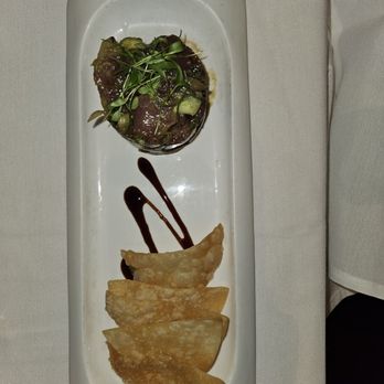 Roy's Restaurant - Big eye tuna poke with avocado and won ton chips - Seafood Near Me - Anaheim, California Roy's Restaurant - Big eye tuna poke with avocado and won ton chips - Seafood Near Me - Anaheim, California