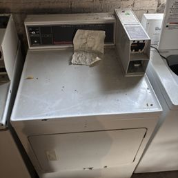 606 Realty - sign says "Filled with human poop" in the washing machine room - Property Management Near Me - Chicago, Illinois