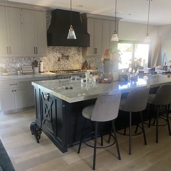 Affordable Additions - Large custom island 5' wide by 12ft long quartzite slab. Wire scrapped french oak wide plank wood floors - General Contractors Near Me - Whittier, California