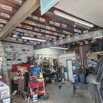 Econo Smog & Tune - Clean shop, license plates from all over the country,  and then some. - Auto Repair Near Me - Needles, California