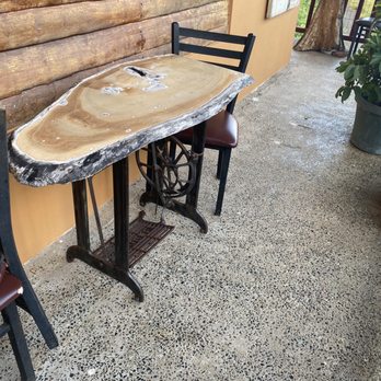 El Jibarito - Outdoor area - pretty cool table - make out of an old fashioned sewing machine base and a piece of local wood! - Latin American Near Me - Aguada, Puerto Rico