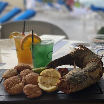 Ola Ocean Front - Red snapper entree with fried coco bread. Also pictured are the El Yunque and Sailor Passion cocktails. - Breakfast & Brunch Near Me - San Juan, Puerto Rico Ola Ocean Front - Red snapper entree with fried coco bread. Also pictured are the El Yunque and Sailor Passion cocktails. - Breakfast & Brunch Near Me - San Juan, Puerto Rico