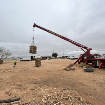 Jo Jo's Bee Lawn & Tree Service - Crane moving a pallet of wood - Tree Services Near Me Jo Jo's Bee Lawn & Tree Service - Crane moving a pallet of wood - Tree Services Near Me