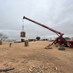 Jo Jo's Bee Lawn & Tree Service - Crane moving a pallet of wood