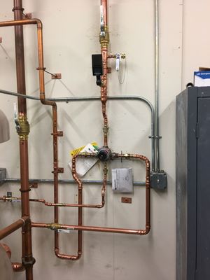 Maguire Company Logo