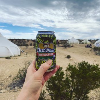 Basecamp Terlingua - Enjoying a pickle beer on our first evening in the campsite surrounded by Lotus tents - Vacation Rentals Near Me - Terlingua, Texas