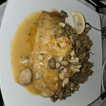 Bourbon Street Seafood Kitchen - Grilled red fish with crab meat, grilled shrimp and dirty rice. - Cajun/Creole Near Me - San Antonio, Texas