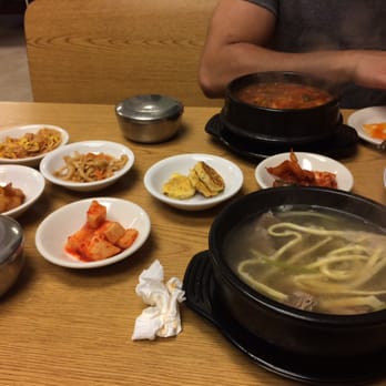 Seoul Bistro - Galbitang (front) and spicy galbi stew (back) along with their banchan. - Korean Near Me - Tulsa, Oklahoma