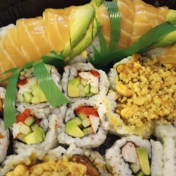 On Rice - Red Dragon roll on top, Sallmon roll, California roll and Spicy Salmon roll. - Japanese Near Me - Ottawa, Ontario