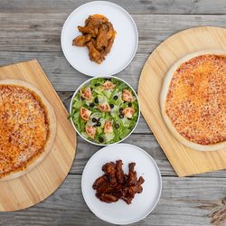 Uncle Vito's Pizzeria - SUNDAY SPORTS BUNDLE FEAST! 

Game day just got better! 

 2 Large Pizzas
 20 Delicious Wings
 1 Fresh Salad

ALL FOR $49.99!