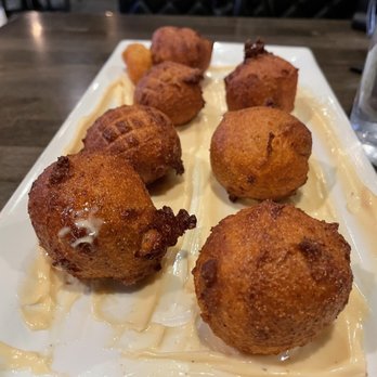 Harrison’s Speakeasy - Huge, tasty hushpuppies served on a smear of "voodoo sauce". - Restaurants Near Me - Harrison Township, Michigan