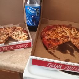 a half eaten pizza and a half eaten pizza