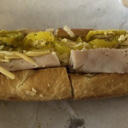 a sub sandwich with pickles and cheese a sub sandwich with pickles and cheese
