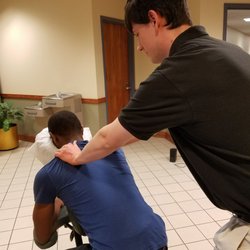 The Roots of Health - Ian Thomas gives chair massages at a local college to relieve stress during mid-terms and finals.