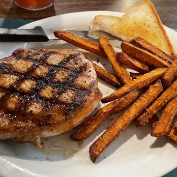 Quacker's Steakhouse - Pork chop and sweet potato fries - American Near Me - Mound City, Missouri