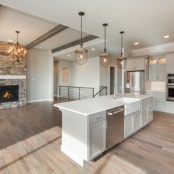 Re-Model Design & Build - Open Kitchen, Farm Sink, Pending lights, Island, White cabinets, Modern fire place