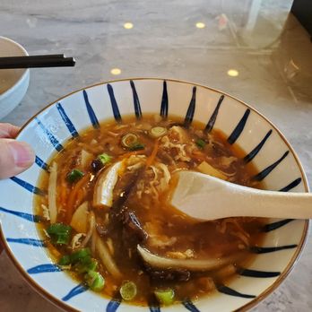Supreme Dumplings - Note: not actual thumb of the waiter. The waiter was wearing purple latex gloves. - Shanghainese Near Me - Kirkland, Washington Supreme Dumplings - Note: not actual thumb of the waiter. The waiter was wearing purple latex gloves. - Shanghainese Near Me - Kirkland, Washington