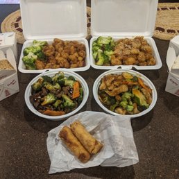 Top left: general tso's chicken, top right: sesame chicken, bottom left: beef and broccoli, bottom right: garlic chicken. Top left: general tso's chicken, top right: sesame chicken, bottom left: beef and broccoli, bottom right: garlic chicken.