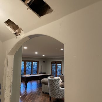 Tarasov Drywall - Before work, holes due to leaky pipe repair - Drywall Installation & Repair Near Me
