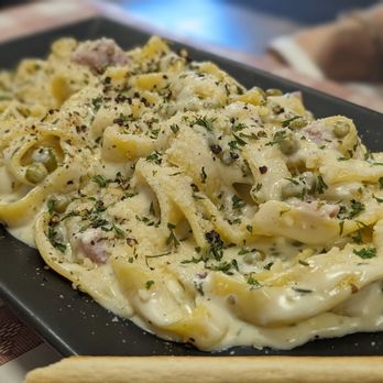 ARTIPASTA - Tagliatelle with creamy ham and sweet green peas - Italian Near Me - Austin, Texas ARTIPASTA - Tagliatelle with creamy ham and sweet green peas - Italian Near Me - Austin, Texas