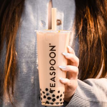 Teaspoon - Modesto - a woman holding a cup of iced tea - Bubble Tea Near Me - Modesto, California Teaspoon - Modesto - a woman holding a cup of iced tea - Bubble Tea Near Me - Modesto, California